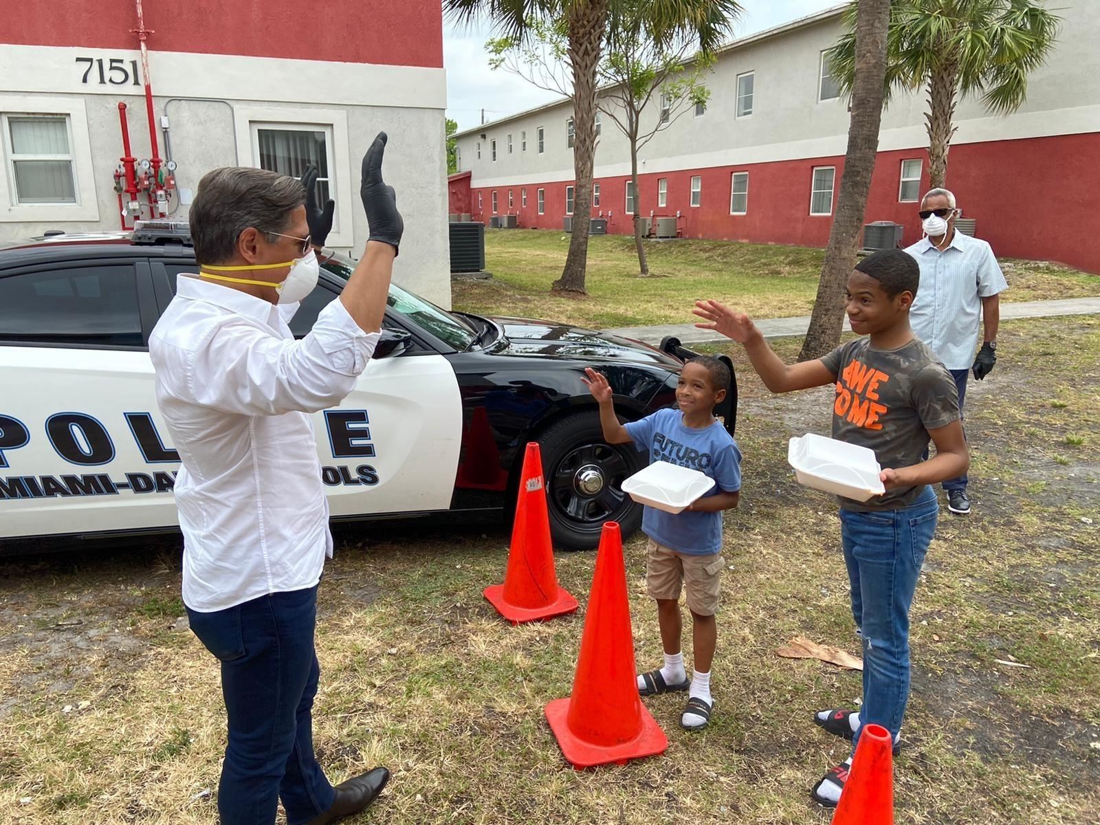 Miami School Superintendent Alberto Carvarlho interacts with students during the district's community feedings.    